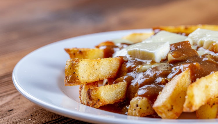 A plate of classic Québec poutine with cheese curds and gravy